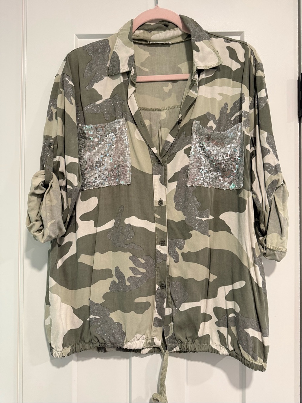 Camo and silver slouchy blouse which ties on the bottom. Size M fits loose.